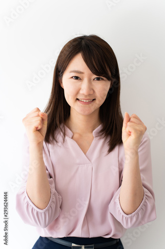 Wallpaper Mural Young business woman cheering against white background Torontodigital.ca