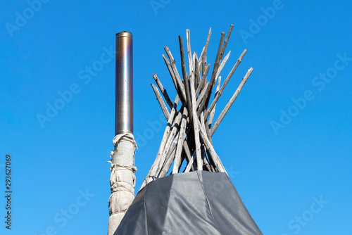 Top of the plague - the homes of the indigenous peoples of Siberia with a chimney stove. photo