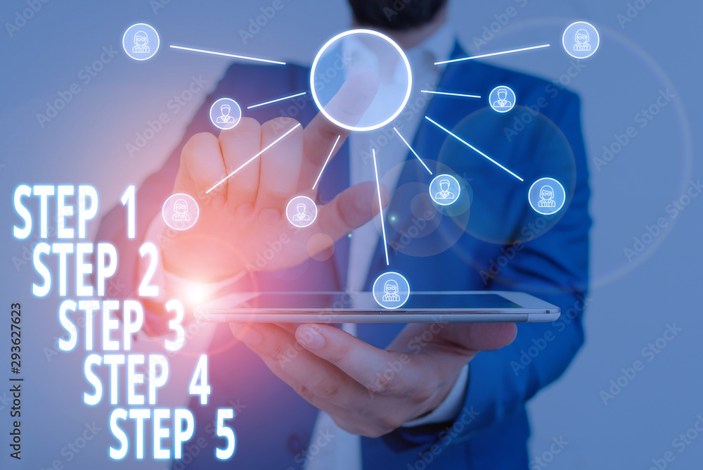 Word writing text Step 1, 2, 3, 4 and 5. Business photo showcasing Steps levels of a process work flow Male human wear formal work suit presenting presentation using smart device Word writing text Step 1, 2, 3, 4 and 5. Business photo showcasing Steps levels of a process work flow Male human wear formal work suit presenting presentation using smart device