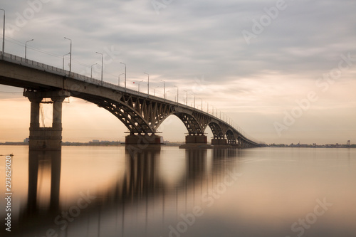 Fototapeta Naklejka Na Ścianę i Meble -  Bridge over the river Volga in sunset. The bridge connects  Saratov and Engels. Russia