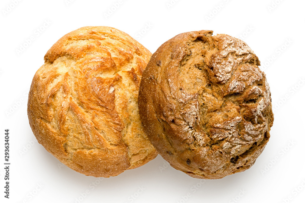 Two round rustic bread rolls isolated on white. White and whole wheat. Top view. Two round rustic bread rolls isolated on white. White and whole wheat. Top view.