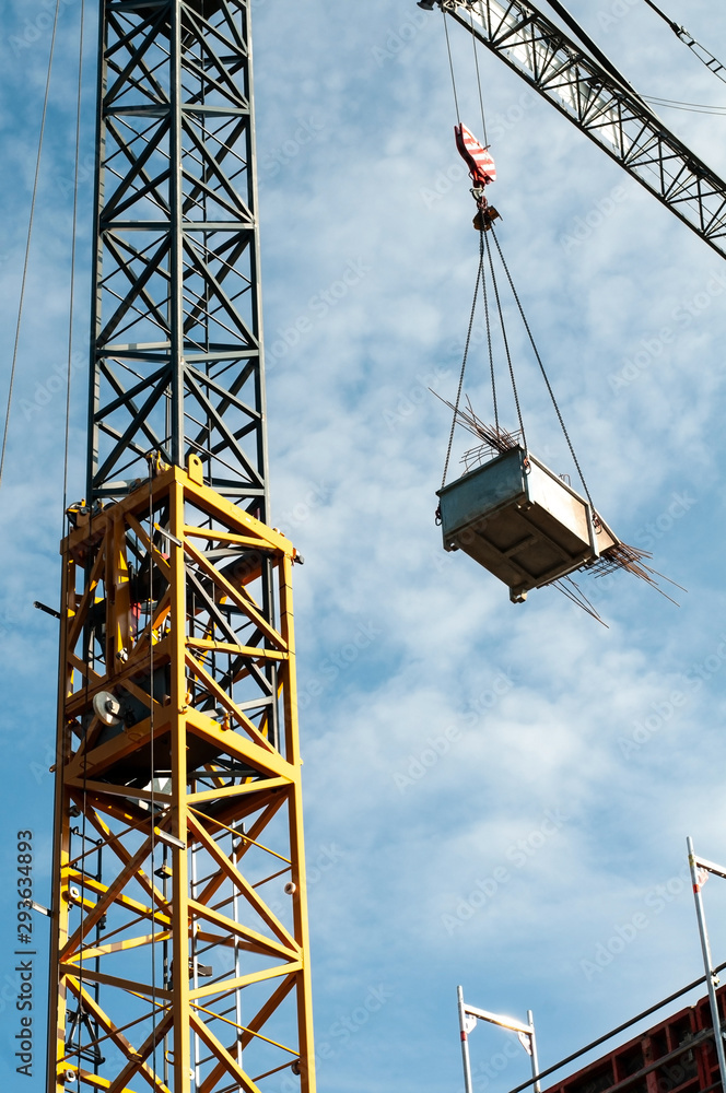 container with metal waste transported by construction crane container with metal waste transported by construction crane