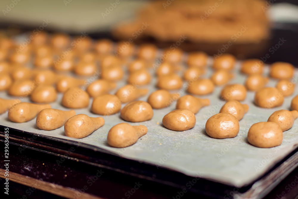 A process of production bakery products at the factory. Sweet cake on the production line at the bakery A process of production bakery products at the factory. Sweet cake on the production line at the bakery