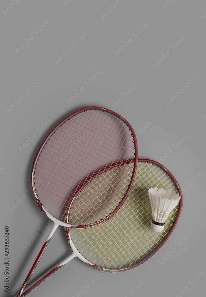 Shuttlecocks and badminton racket on gray background,top view