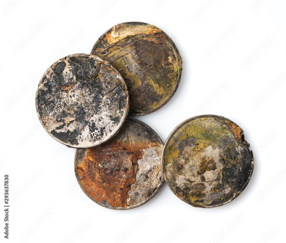 Old rusted coins,Oxidized old coins on white background. Old rusted coins,Oxidized old coins on white background.