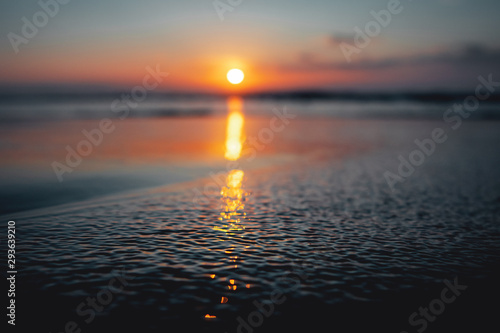 Fototapeta Naklejka Na Ścianę i Meble -  Beautiful sunset ocean view with waves and reflection. Praia da Bordeira at the Algarve Coast in Portugal, Atlantic Ocean