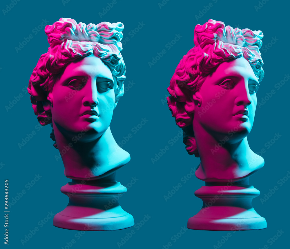 Statue neon. On a blue isolated background. Gypsum statue of Apollo's head. Man.