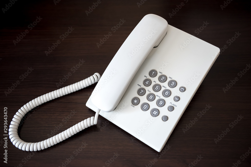 white telephone on wooden background white telephone on wooden background