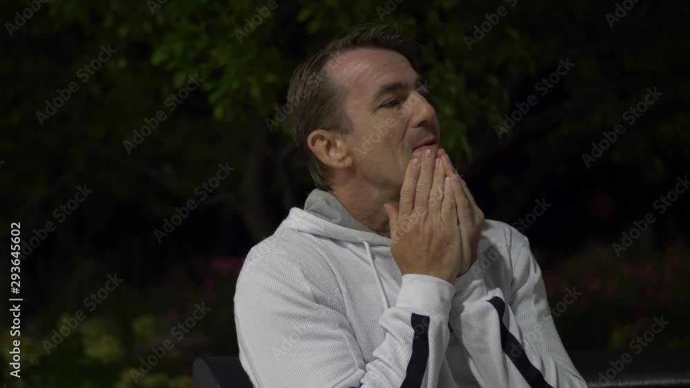 Portrait of man sitting on a bench stressed at night, sad man, depressed man, worried man, thinking man. Portrait of man sitting on a bench stressed at night, sad man, depressed man, worried man, thinking man.