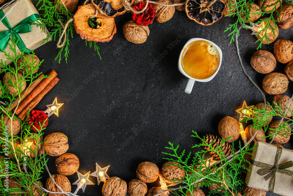 coffee, New Year, Christmas background or Noel holiday festive (nuts, cones, specials, decorations and gifts on the table, greeting card) winter menu concept. food background. copy space. Top view coffee, New Year, Christmas background or Noel holiday festive (nuts, cones, specials, decorations and gifts on the table, greeting card) winter menu concept. food background. copy space. Top view