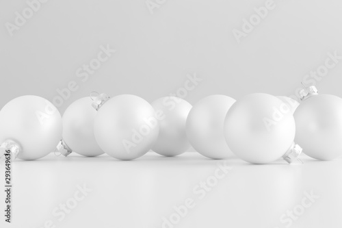 Multiple white matte christmas balls.