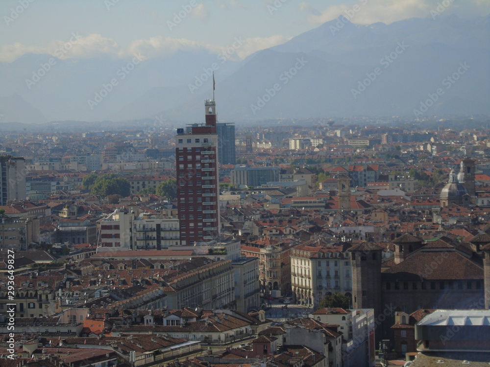 Turin, Italy - 10/02/2019: Travelling around North Italy. Beautiful caption of Turin wih sunny days and blue sky. Panoramic view to the city from Mole Antoneliana. Detailed photography of the old arch