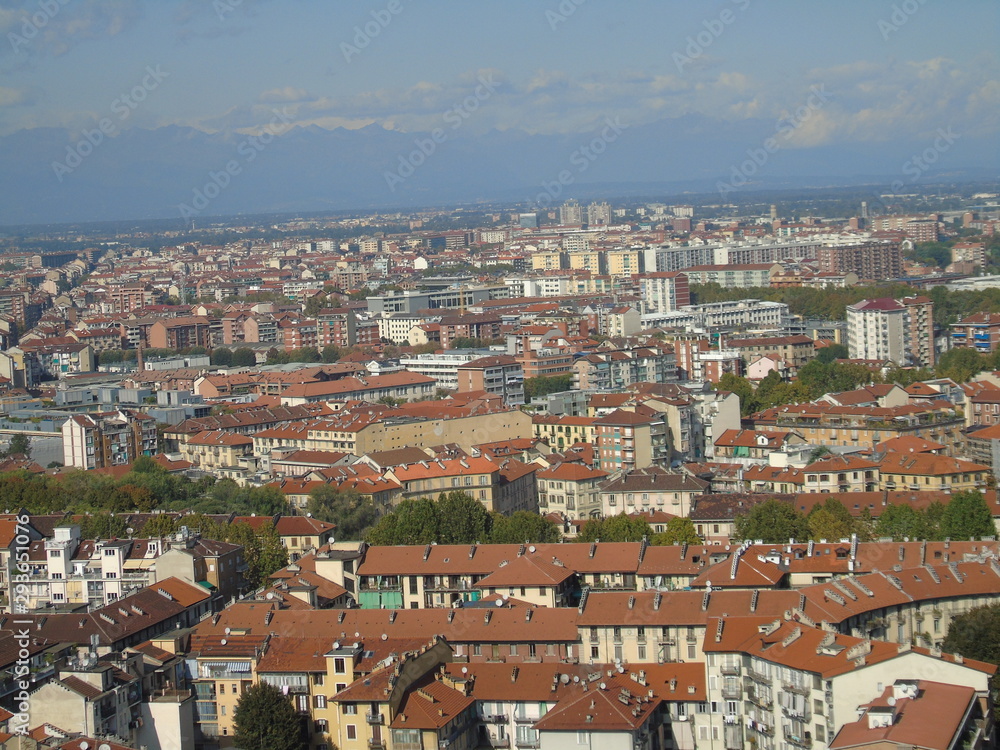 Turin, Italy - 10/02/2019: Travelling around North Italy. Beautiful caption of Turin wih sunny days and blue sky. Panoramic view to the city from Mole Antoneliana. Detailed photography of the old arch