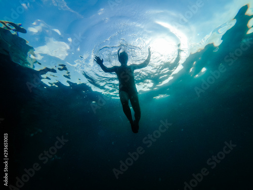 Underwater photo of man snorkeling in a sea