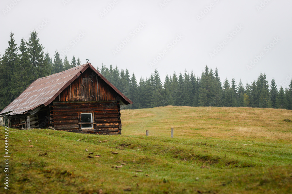 Old house in the mountains. Fog. Dawn. Gicha mountain meadow. Carpathians Old house in the mountains. Fog. Dawn. Gicha mountain meadow. Carpathians
