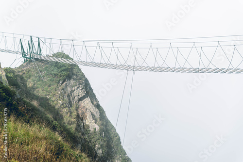 Bridge between cliffs in the fog