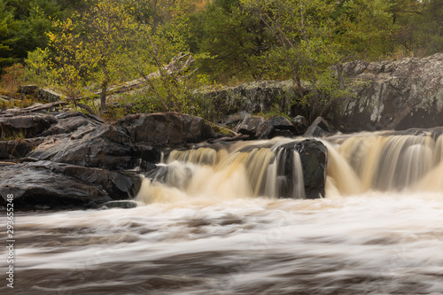 Fototapeta Naklejka Na Ścianę i Meble -  Eau Claire River Waterfall In Autumn