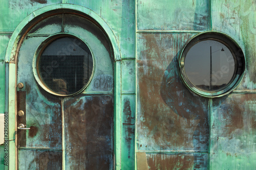 Photography Two round windows and the entrance door