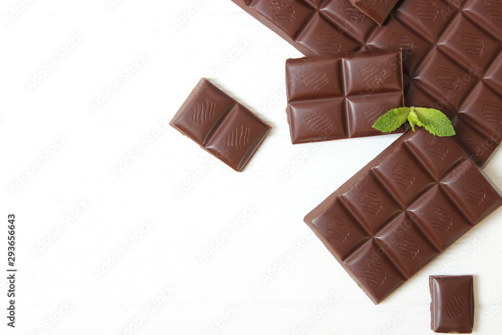 Pieces of chocolate on the table. Pieces of chocolate on the table.