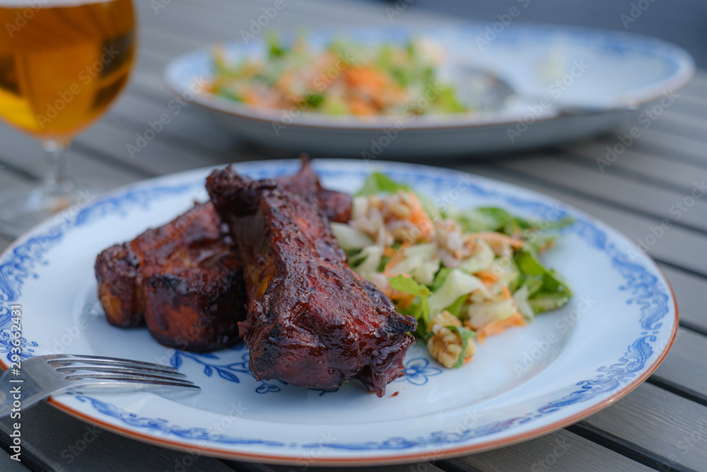 Thick ribs on a plate ready to be eaten Thick ribs on a plate ready to be eaten