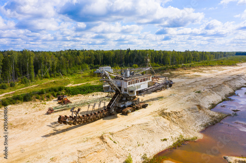 old rusty multi bucket excavator, giant stacker, absetzer in sandy career photo