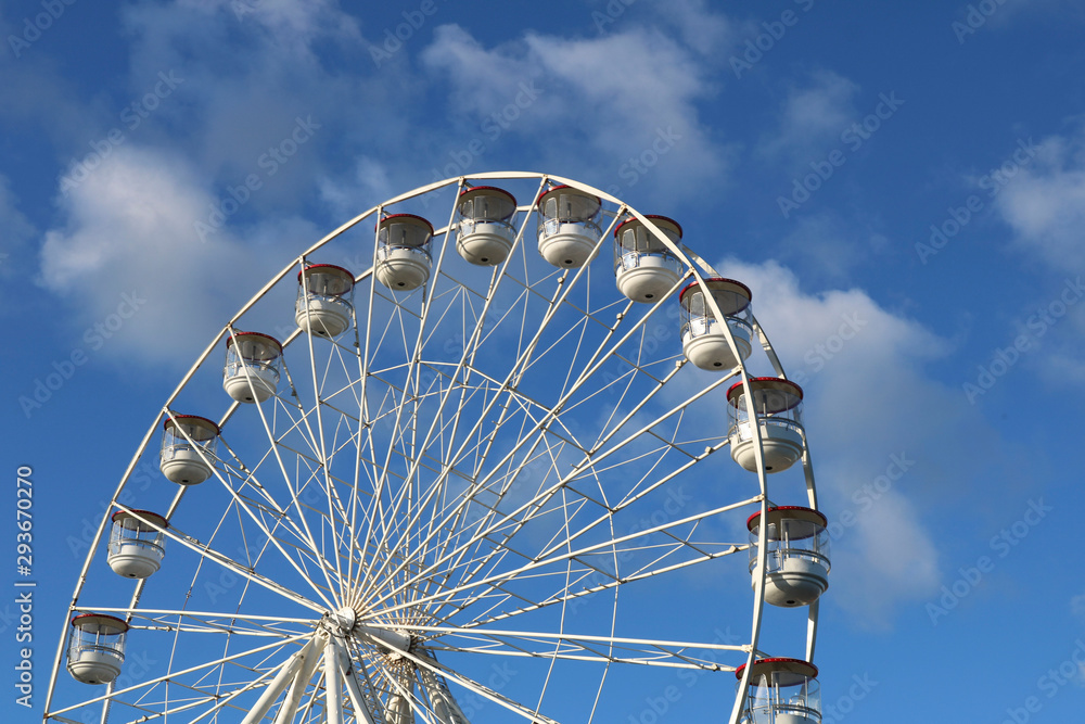 Ferris wheel on blue sky