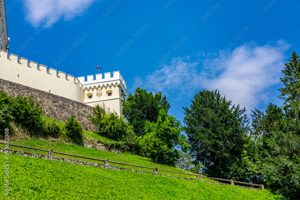 Vien on old castle of Trakoscan in Zagorje, green trees, Croatia on sunny summer day
