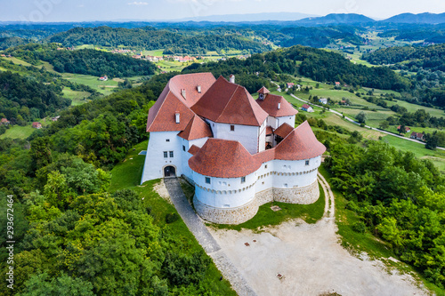 Aerial view of old castle of Trakoscan in green wood in Zagorje, Croatia on sunny summer day photo