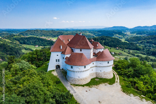Aerial view of old castle of Trakoscan in green wood in Zagorje, Croatia on sunny summer day