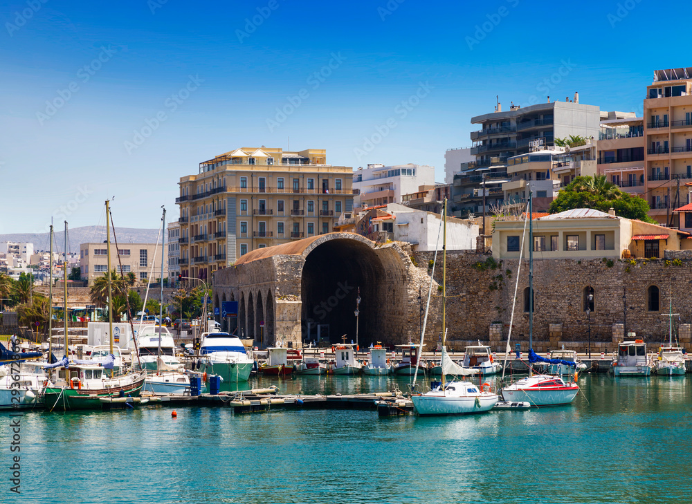 The old Venetian harbour and the Arsenal building in Heraklion, Crete, Greece.