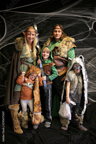 Family Dressed in Forest Elf Costumes for Trick or Treating on Halloween