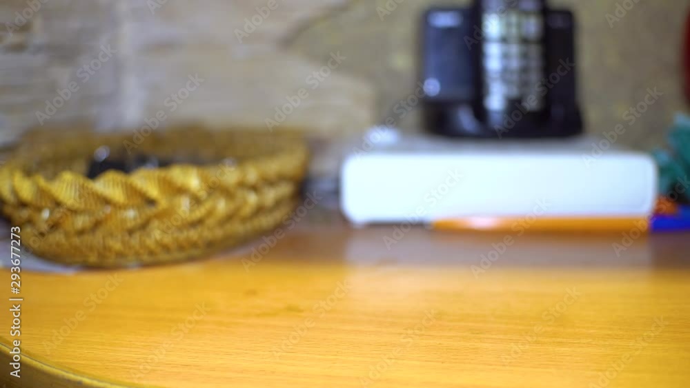 man picks up car keys from the table. close-up. man picks up car keys from the table. close-up.