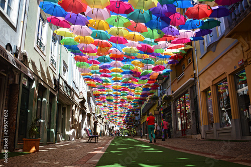 Colorful umbrellas in the streets of Agueda, Portugal photo