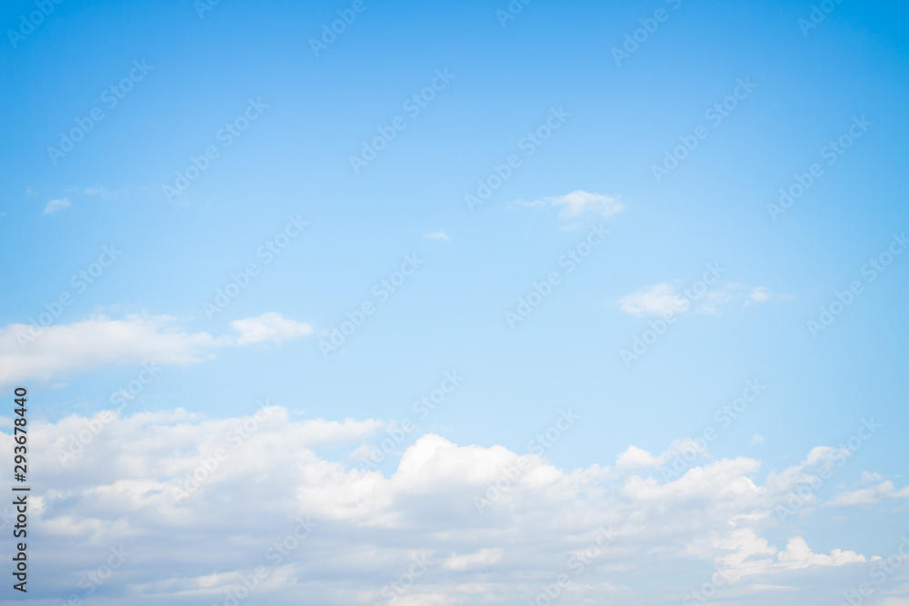 White fluffy clouds in the blue sky in summer