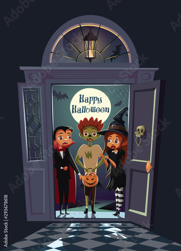 Terrified kids on the doorway scary house on Halloween night.Trick or treat