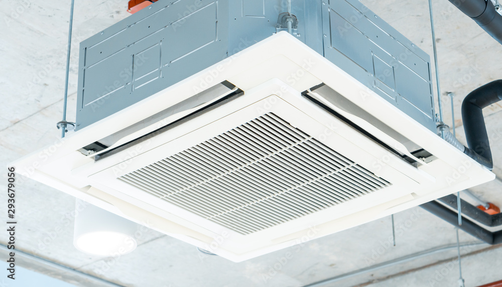 Modern ceiling air conditioning system in loft office, cassette type Modern ceiling air conditioning system in loft office, cassette type