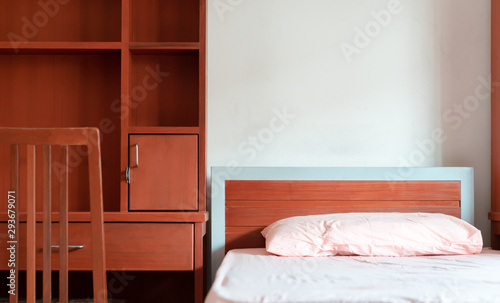 Empty Bedroom of student dormitory in the university, clean interior hostel photo