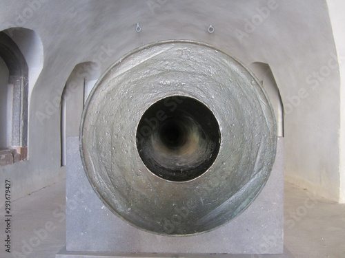 In front of an old cannon