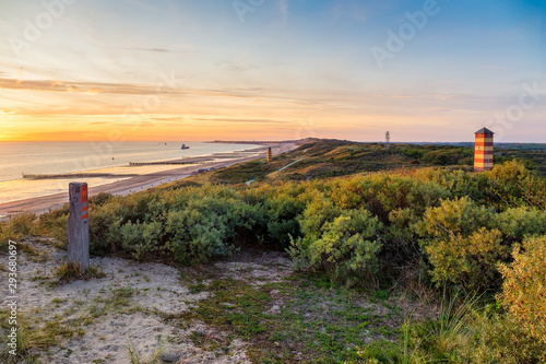 Fototapeta Naklejka Na Ścianę i Meble -  Lighthouse-like towers on the beach at Dishoek