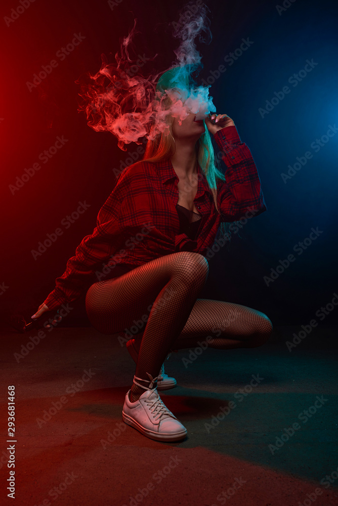 Vape girl. Photo studio shots. Beautiful blonde is vaping. Vape girl. Photo studio shots. Beautiful blonde is vaping.