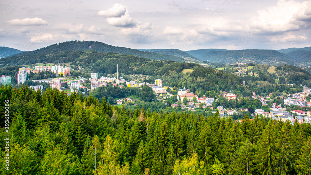 Scenic view of Tanvald and spruce forests of hilly landscape around Tanvaldsky Spicak mountain, Jizera Mountains, Czech Republic