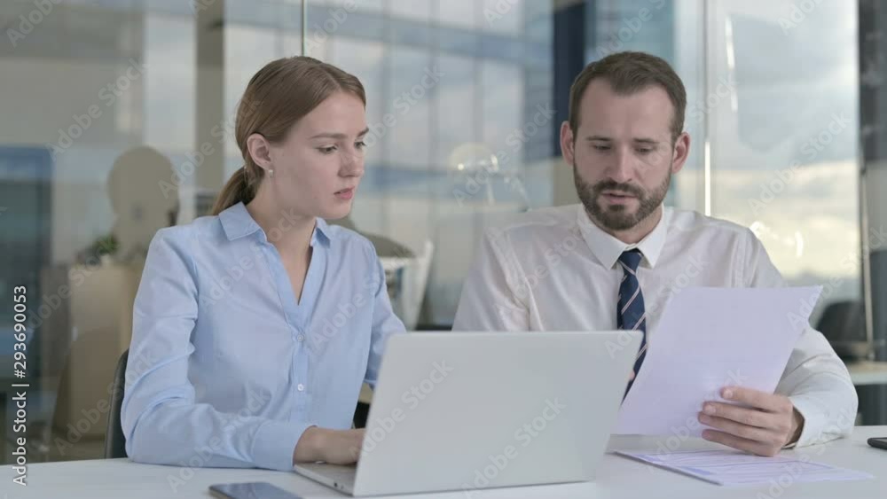 Executive Business people Reading Documents and using Laptop Executive Business people Reading Documents and using Laptop