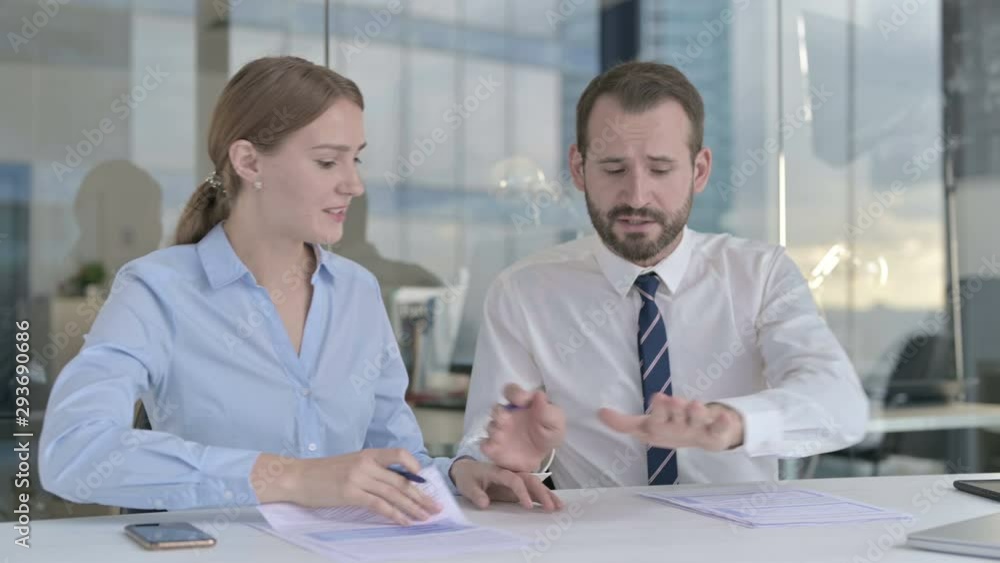 Executive Business people having Serious Arguments on Documents Executive Business people having Serious Arguments on Documents