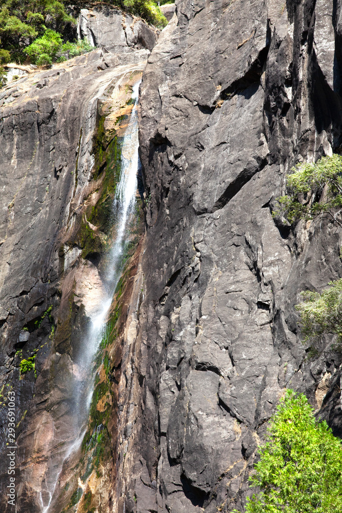 Granite formations and drying water fall in Yosemite Granite formations and drying water fall in Yosemite