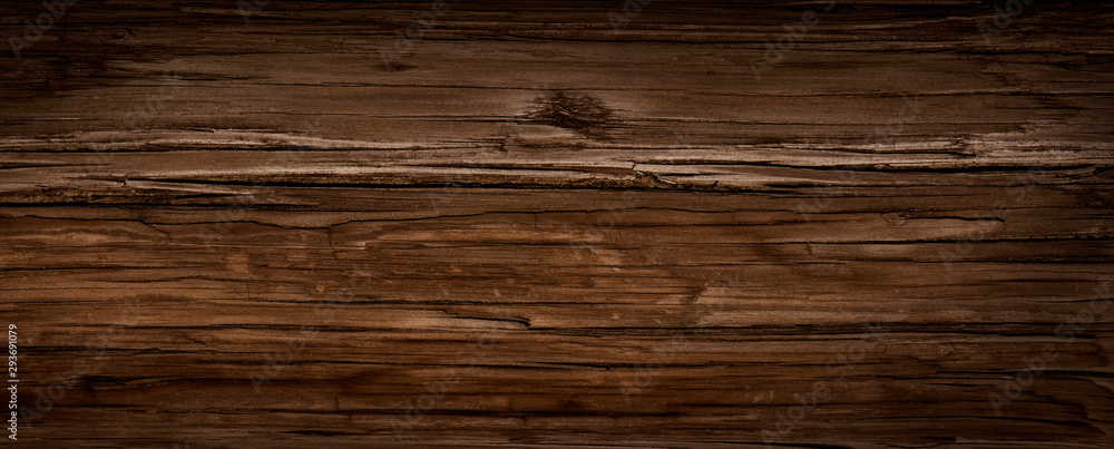 Fototapeta premium Warm orange and red brown reclaimed wood surface with aged boards lined up. Wooden planks on a wall or floor with grain and texture. Neutral stained vintage wood background.