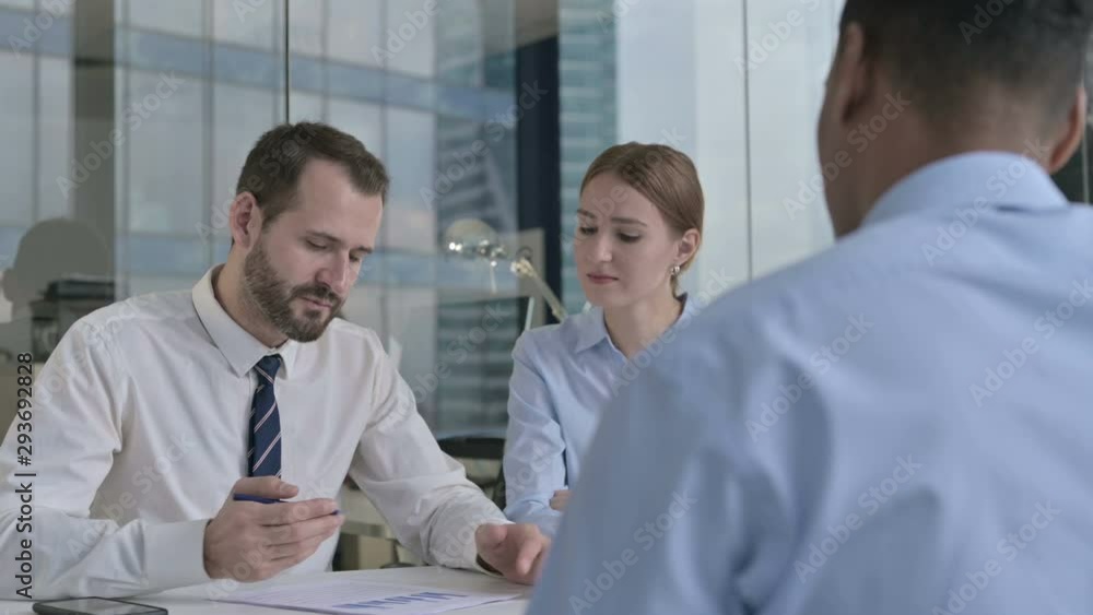 Rear Back View of Guy having Conversation with Executive Business People Rear Back View of Guy having Conversation with Executive Business People