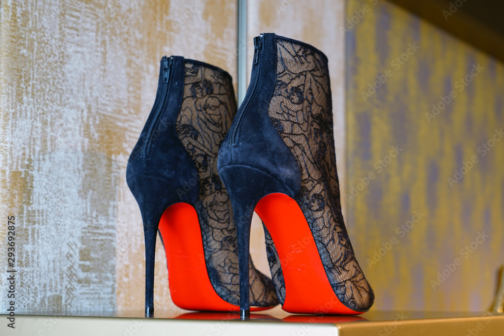 VENICE, ITALY -8 APR 2019- View of high heel pump shoes by footwear brand Christian Louboutin for sale in a store in Photos | Adobe Stock