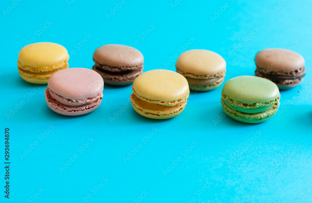 Obraz premium French macarons dessert on a blue background