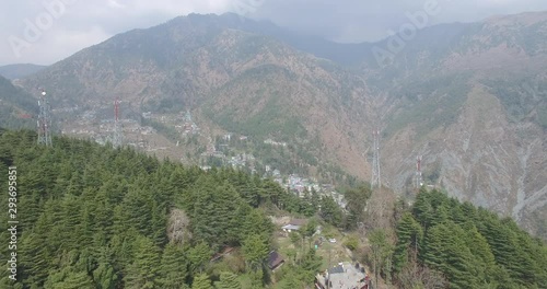 Wide aerial flyover of Dharmasala, India, residence of the Dali Lama. photo