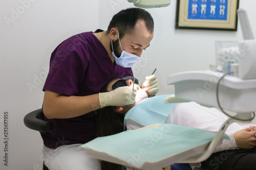 dentist doctor examines a woman patient medicine checkup